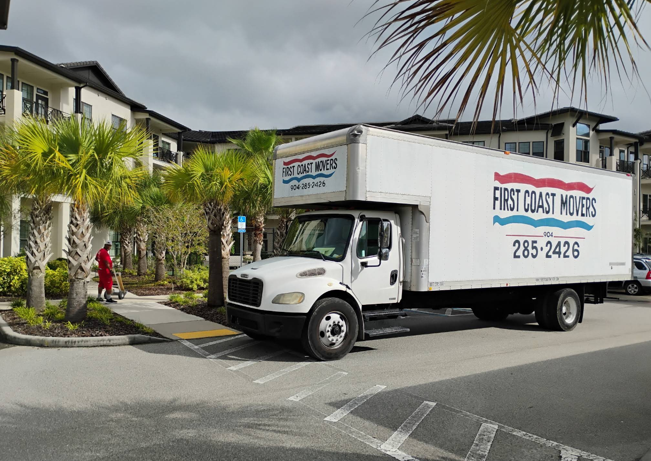 Moving truck parked outside a residential house.