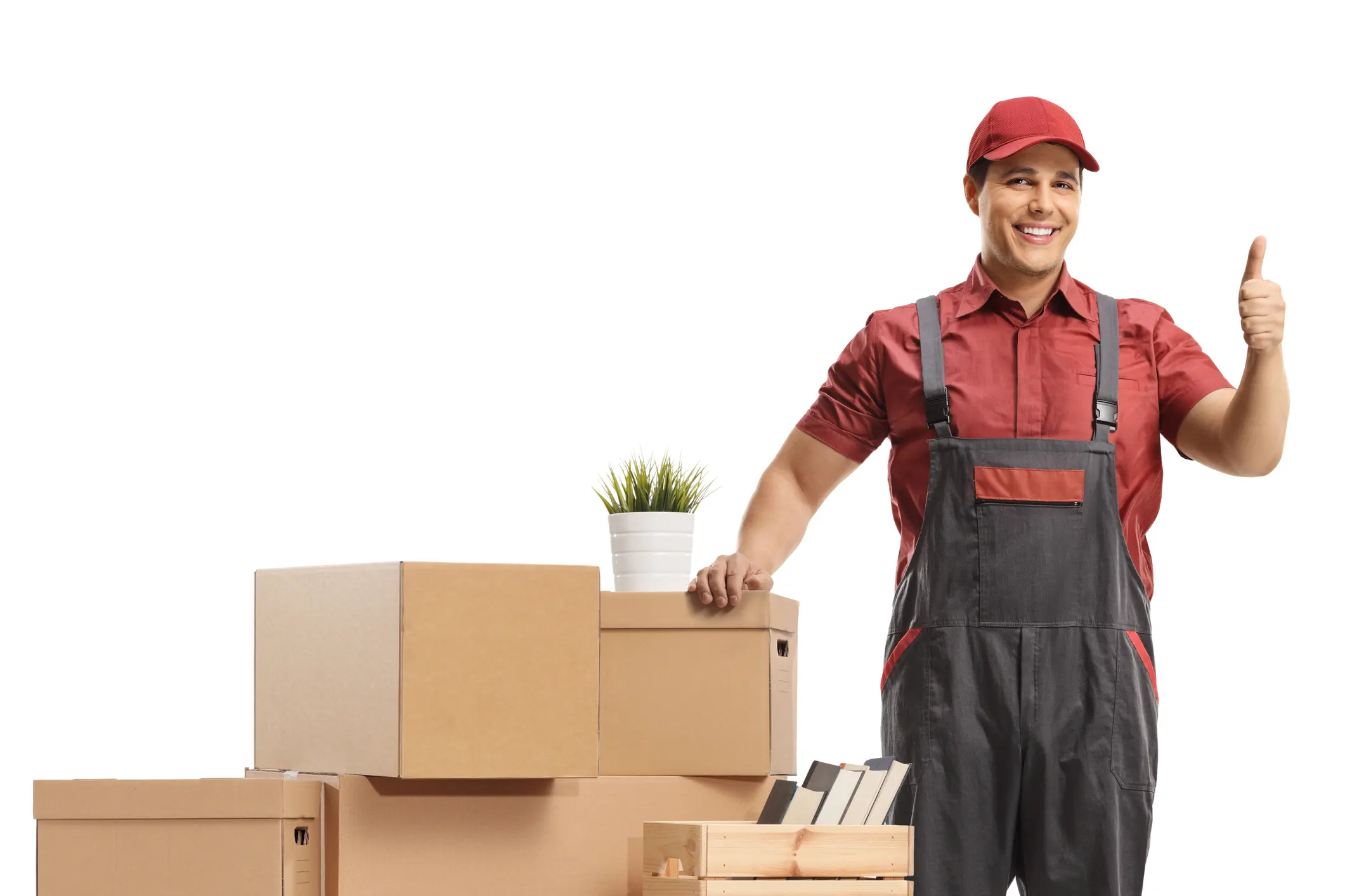 Mover posing with a pile of boxes for removal and showing thumbs up isolated on white background